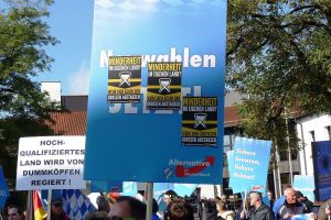 Sticker of the Identitarian Movement on a sign at an AfD demo in Freilassing