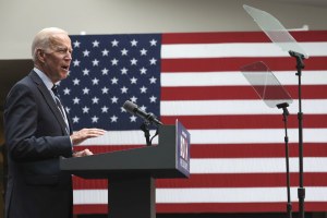 Candidate Joe Biden speaks in front of an American flag