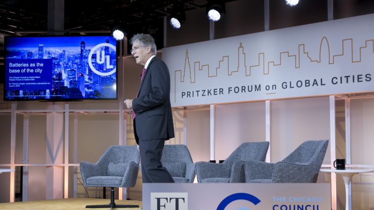 A speaker on-stage at the Pritzker Forum on Global Cities
