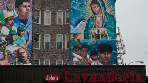 Murals above a laundromat in Chicago's Pilsen neighborhood