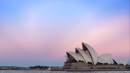 Sydney Opera House in front of a sunset sky