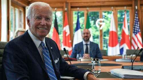 President Biden sits at a working lunch at the G7 Summit.