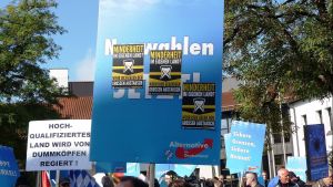 Sticker of the Identitarian Movement on a sign at an AfD demo in Freilassing