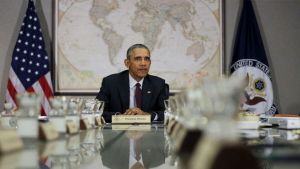 President Obama in front of a world map.