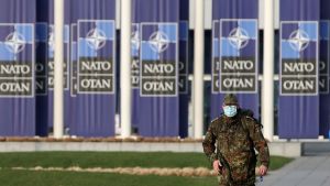 A military officer walks ahead of a NATO Foreign Ministers' meeting at the Alliance's headquarters in Brussels, Belgium March 23, 2021.