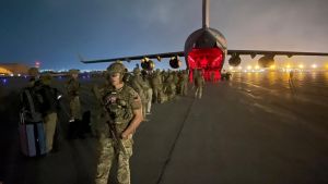 US troops walk towards a plane in Afghanistan