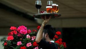 image of waiter carrying drinks in Spain