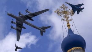 A plane flies over a church in Russia