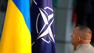 NATO and Ukrainian flags are set up prior to a media conference at NATO headquarters in Brussels on October 11, 2023.