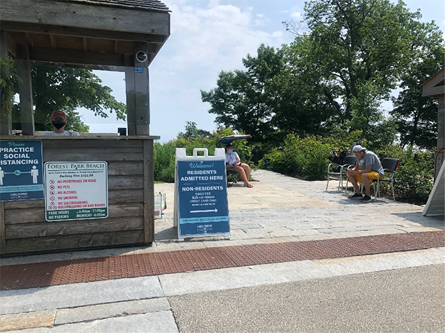 A sign at the Forest Park beach entrance, denoting a residents' entrance