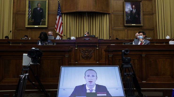 Mark Zuckerberg appears on a video feed testifying before Congress. 