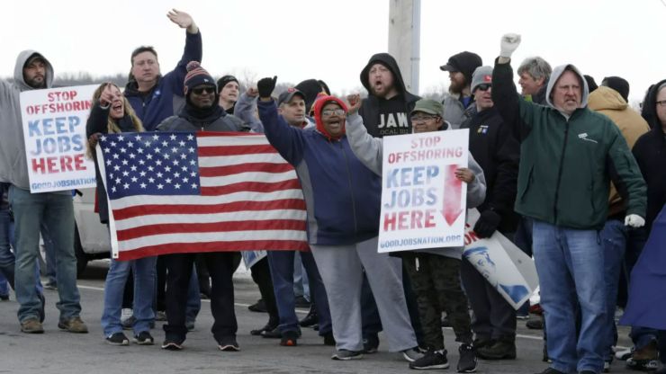 General Motors employees gather outside the plant for a protest in Ohio