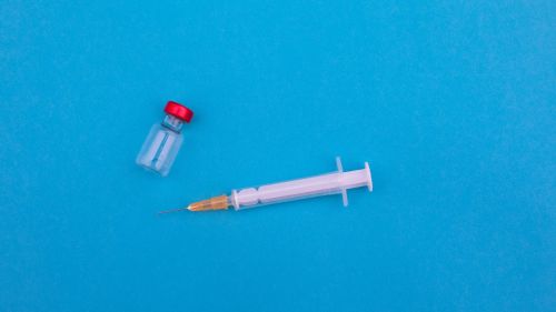 vaccine syringe and bottle 