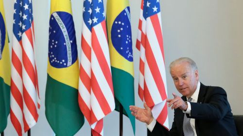 President Joe Biden in front of the American and Brazilian flags