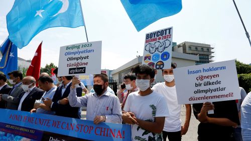 Ethnic Uyghur demonstrators take part in a "No Beijing 2022" protest calling for a boycott of Beijing 2022 Winter Olympic Games, in front of the Olympic House