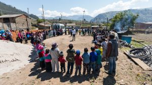 Community members stand in a circle in Ecuador.
