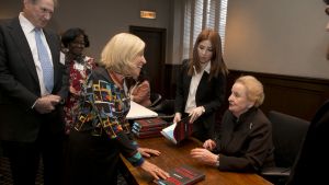 Madeline Albright signing copies of her book, Fascism: A Warning
