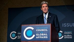 John Kerry speaking at a podium at a Chicago Council on Global Affairs event.