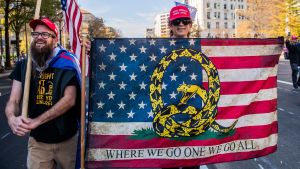 A Qanon supporter marches in route to the Supreme Court during the Million Maga March protest regarding election results on November 14, 2020 in Washington D.C