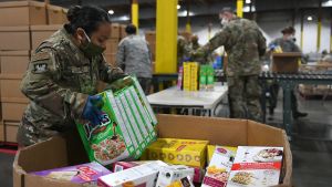 A member of the National Guard works at a COVID-19 food warehouse