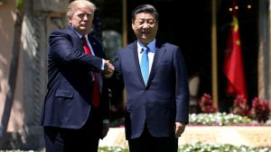 US President Donald Trump and Chinese President Xi Jinping shake hands