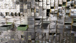A wall of safety deposit boxes in a bank