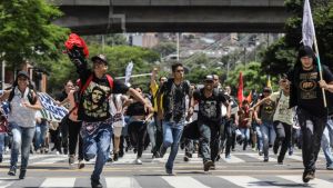 Students protest in Medellin, Colombia, on Oct. 12 during a protest in the framework of a general strike.