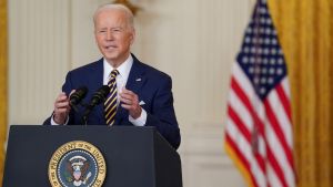 President Biden stands at a podium giving a speech