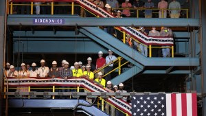 Workers wait to hear President Joe Biden speak at a shipyard in Philadelphia