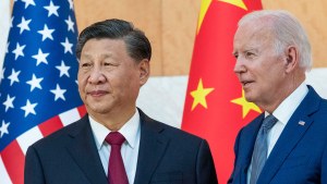 President Joe Biden stands with Chinese President Xi Jinping before a meeting on the sidelines of the G20 summit 