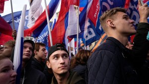 Young Russians hold Russian flags