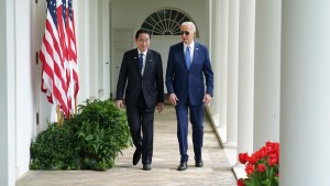 President Joe Biden and Japanese Prime Minister Fumio Kishida walk along the colonnade of the White House